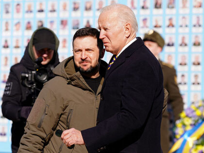 US President Joe Biden (R) is greeted by Ukrainian President Volodymyr Zelensky (L) during