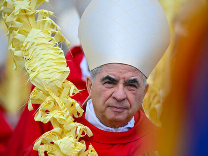 Italian Cardinal Giovanni Angelo Becciu takes par in the procession of the Palm Sunday mas