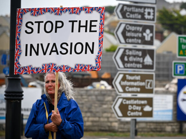 PORTLAND, ENGLAND - SEPTEMBER 16: Protesters against illegal immigration and the Bibby Stockholm barge demonstrate, on September 16, 2023 in Portland, England. The floating accommodation has been hired by the UK Home Office to house between 400 and 500 asylum seekers, although its first residents were evacuated days after their …