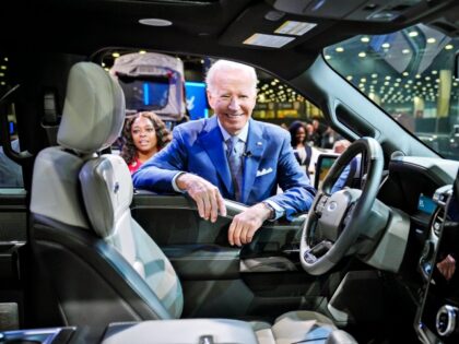 Reportage: President Joe Biden looks at the Ford F-150 Lighting while he tours the North A