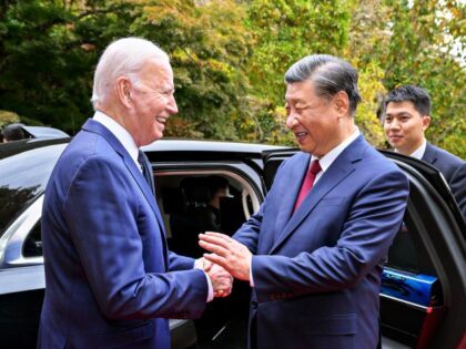 U.S. President Joe Biden escorts Chinese President Xi Jinping to his car to bid farewell a