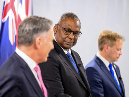 US Defense Secretary Lloyd Austin (C) participates in a joint press conference during the