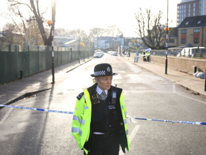 LONDON, ENGLAND - DECEMBER 06: Police officers at the scene of a fatal shooting on Decembe