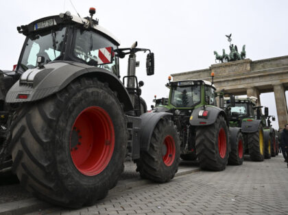 BERLIN, GERMANY - DECEMBER 18: German farmers gather with their tractors in front of the B