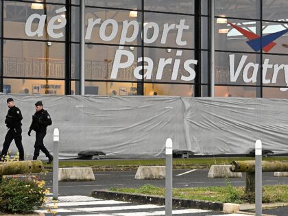 French gendarmes patrol around a terminal at Vatry airport, north-eastern France, on Decem