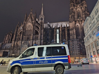 23 December 2023, North Rhine-Westphalia, Cologne: A police vehicle is parked in front of