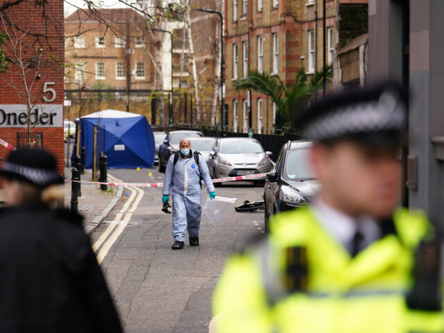 A police forensic officer at a property in Cranwood Street, central London, where a man di