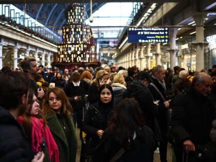 Passengers wait for news of Eurostar departures at St Pancras station in London on Decembe