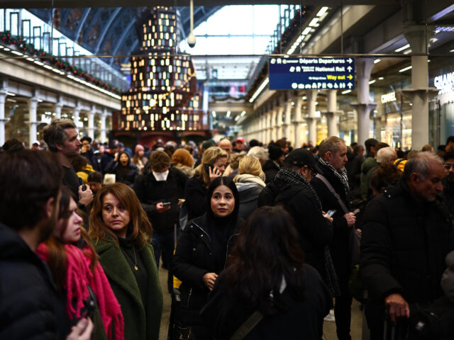 Passengers wait for news of Eurostar departures at St Pancras station in London on Decembe