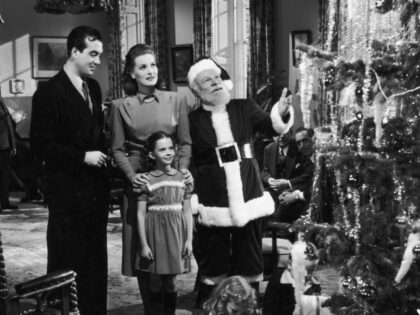 L-R: Actors John Payne, Maureen O'Hara, Edmund Gwenn (dressed as Santa Claus), and young N