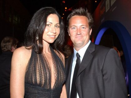 Actors Minnie Driver and Matthew Perry pose during the Entertainment Industry Foundation a