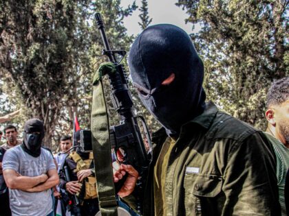 NABLUS, PALESTINE - 2023/10/23: A masked gunman takes part in the funeral of two Palestini
