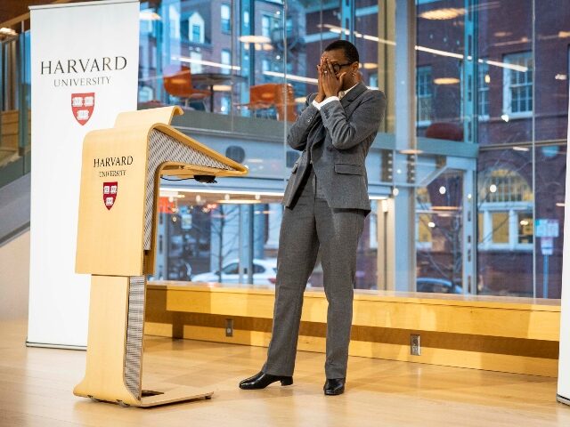 Harvard Prez Claudine Gay holds her face in her hands