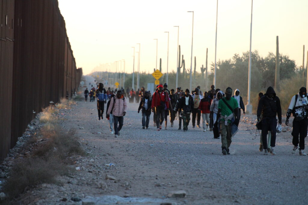 A steady stream of migrants continue to flow across the Arizona border with Mexico near Lukeville. (Randy Clark/Breitbart Texas)