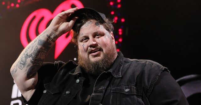 PHOTO: Singer Jelly Roll Donates Tractor-Trailer of Toys to Children