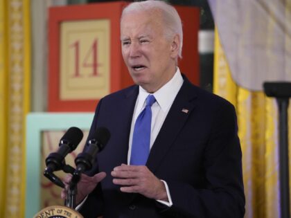 WASHINGTON, DC - DECEMBER 11: President Joe Biden waves after speaks during a Hanukkah rec