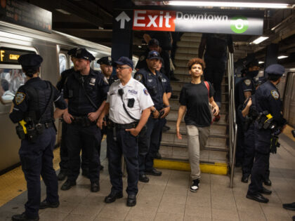 NEW YORK, NEW YORK - MAY 8:Police keep a watchful eye over the Broadway Lafayette subway s
