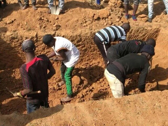 This image grab made from an AFPTV video taken in Maiyanga village, in Bokkos local government, on December 27, 2023 shows families burying in a mass grave their relatives killed in deadly attacks conducted by armed groups in Nigeria's central Plateau State. The death toll from a series of attacks …