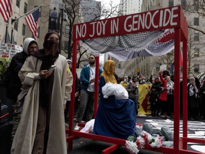NEW YORK, NY - DECEMBER 25: Pro-Palestinian demonstrators demand that Christmas not be cel
