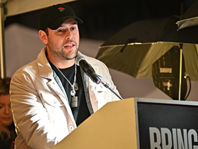 TEL AVIV, ISRAEL - DECEMBER 23: Scooter Braun speaks during a rally calling for the release of the hostages during heavy rain outside The Museum of Art known as the 'The Hostages and Missing Square' on December 23, 2023 in Tel Aviv, Israel. Families and supporters of the hostages, around …