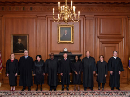 In this image provided by the Supreme Court, members of the Supreme Court pose for a photo