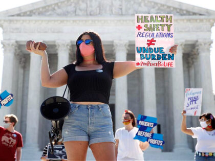 Terrisa Bukovinac, founder of Pro-Life San Francisco, holds a model of a fetus as she and