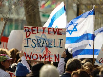 Demonstrators gather during a "#metoo unless you are a Jew" protest outside of U
