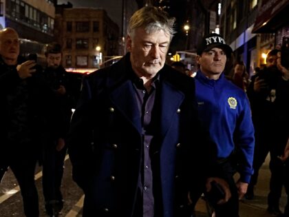 NEW YORK, NEW YORK - DECEMBER 18: Alec Baldwin is escorted away from a pro-Palestine prote