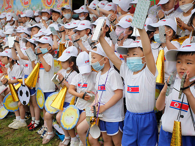 FILE - Children cheer during an event marking the 73rd anniversary of the International Ch