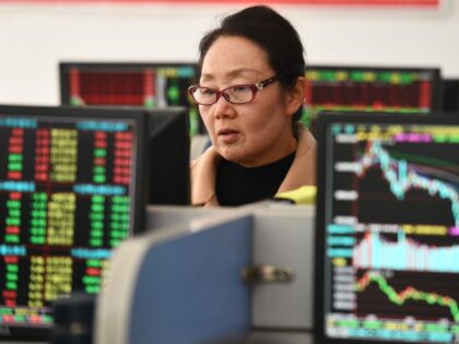 FUYANG, CHINA - DECEMBER 5, 2023 - Investors pay attention to the stock market at a securi