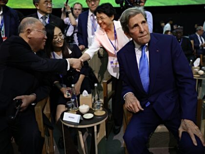 Xie Zhenhua, China's special envoy for climate change, left, and John Kerry, US special pr