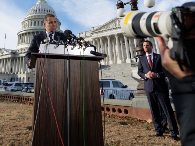WASHINGTON - DECEMBER 13: Photographers take photos as Hunter Biden, son of President Joe Biden, makes a statement to the press outside the U.S. Capitol about testifying publicly to the House Oversight and Accountability Committee on Wednesday, December 13, 2023. Biden's defense attorney Abbe Lowell, left, and Rep. Eric Swalwell, …