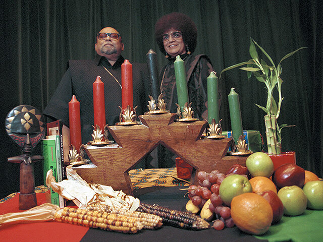 Portrait of African American author, activist, and professor Maulana Karenga with his wife