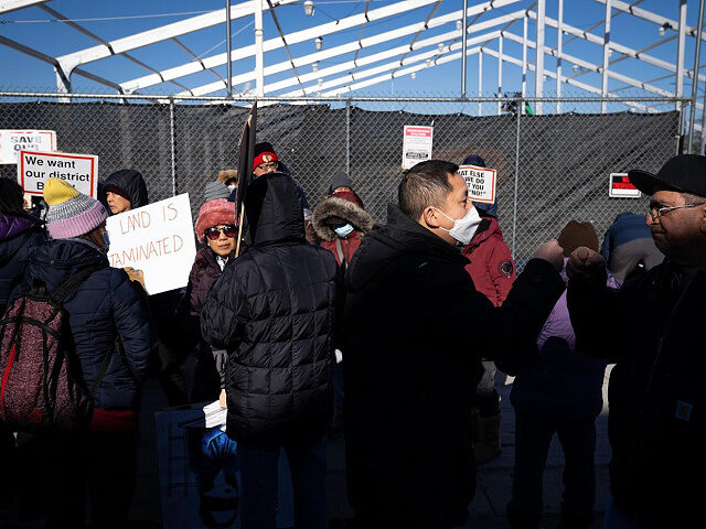 Protesters rally as work progresses on Chicago's first government-run tent encampment for migrants at a lot in the Brighton Park neighborhood on Wednesday, Nov. 29, 2023. (E. Jason Wambsgans/Chicago Tribune/Tribune News Service via Getty Images).