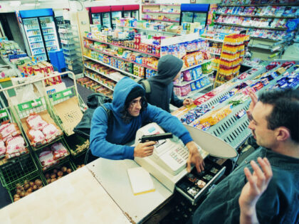 A cashier at convenient store is robbed at gunpoint (Stock photo via Getty).