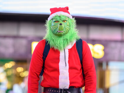The Grinch visits Times Square on December 06, 2020 in New York City. Many holiday events