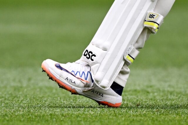 The 37-year-old's shoes had the names of his daughters Aisha and Ayla taped to the side of