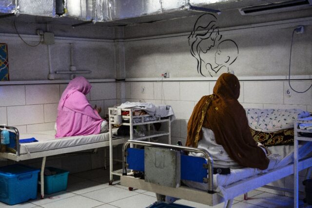 Afghan women sit beside their newborns at the Doctors Without Borders (MSF)-run maternity