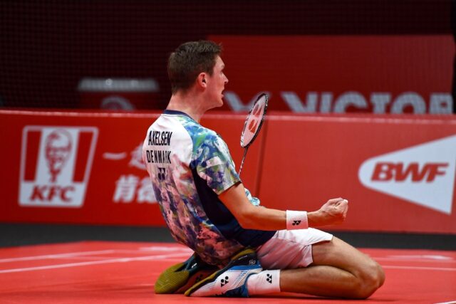 Denmark's Viktor Axelsen celebrates after beating China's Shi Yuqi in the men's singles fi