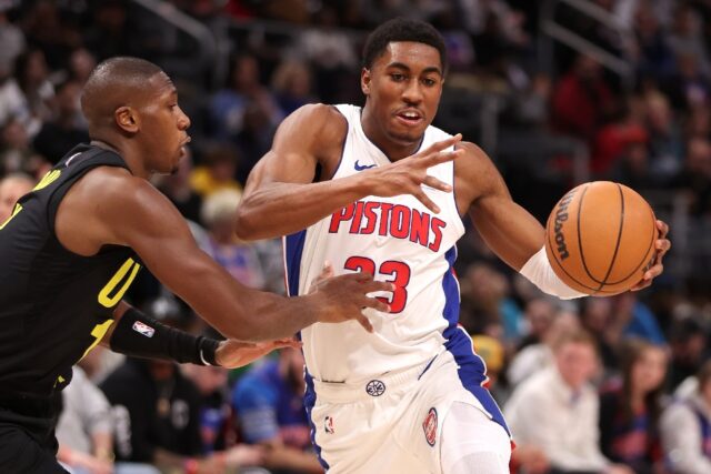 Detroit's Jaden Ivey tries to drive around Kris Dunn of the Utah Jazz in the Pistons' 119-