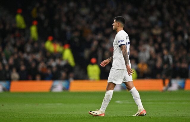 Under fire: Tottenham defender Cristian Romero leaves the pitch after being sent off at ho