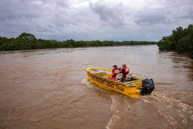 Flash floods swamped northeastern Australia on December 18, with raging waters severing ro