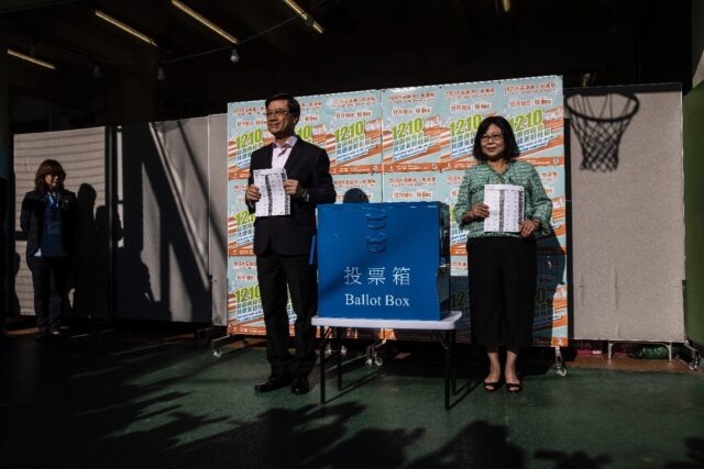 Hong Kong city leader John Lee (centre L) said this year's election was 'the last piece of