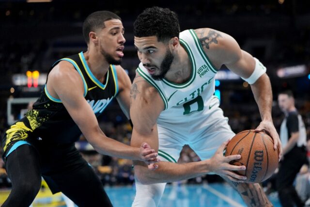 Indiana's Tyrese Haliburton guards Jayson Tatum of the Boston Celtics in the Pacers' victo