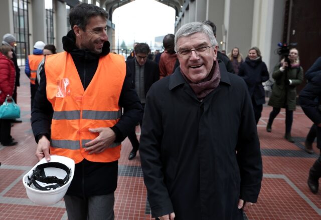 IOC head Thomas Bach (R) and president of the Paris 2024 Organising Committee for the Olym