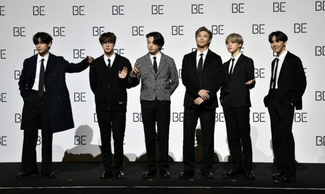 Jung Kook (3rd from L) and Jimin (5th from L) are the final two members of the megagroup t