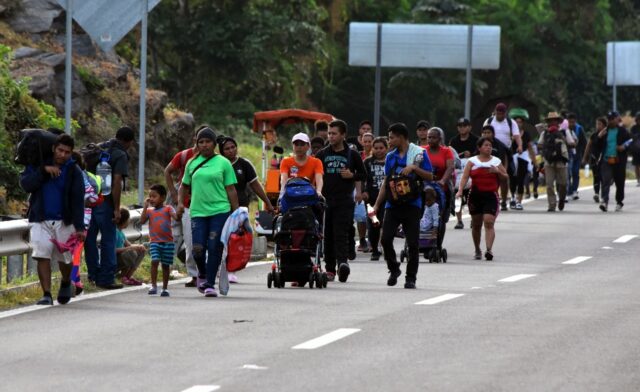 Migrants take part in a caravan towards the border with the United States in Mapastepec, i