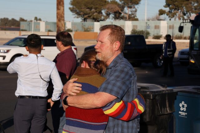 People embrace following the shooting at the University of Nevada, Las Vegas, campus in La