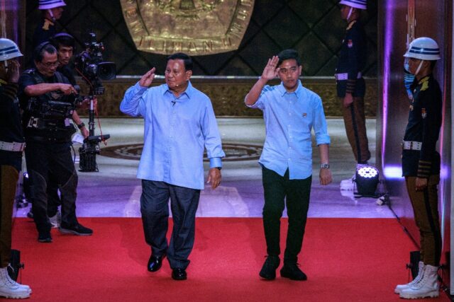 Presidential candidate and Indonesia's Defence Minister Prabowo Subianto (L) has opened up
