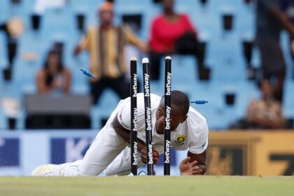 South Africa's Kagiso Rabada runs out India's Jasprit Bumrah (unseen) during the third day